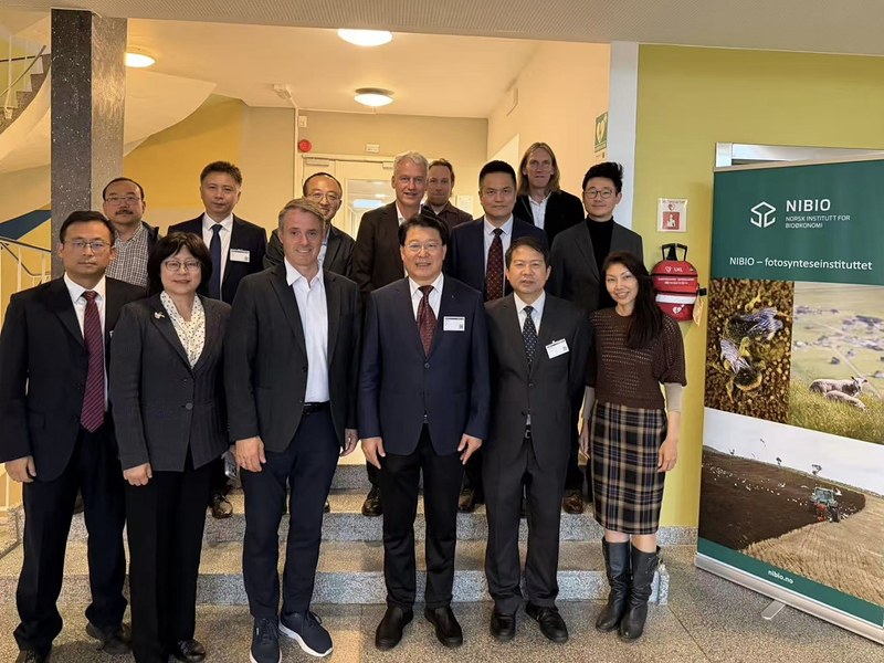 CAAS delegation led by Vice President Liu Xianwu with NIBIO colleagues in front of a NIBIO banner, September 2026